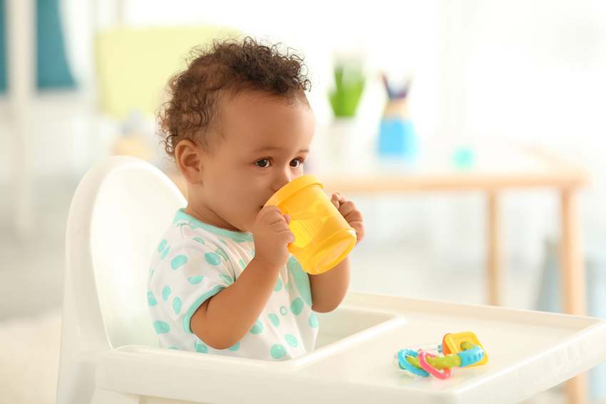 Image showing a kid drinking water with his sipper