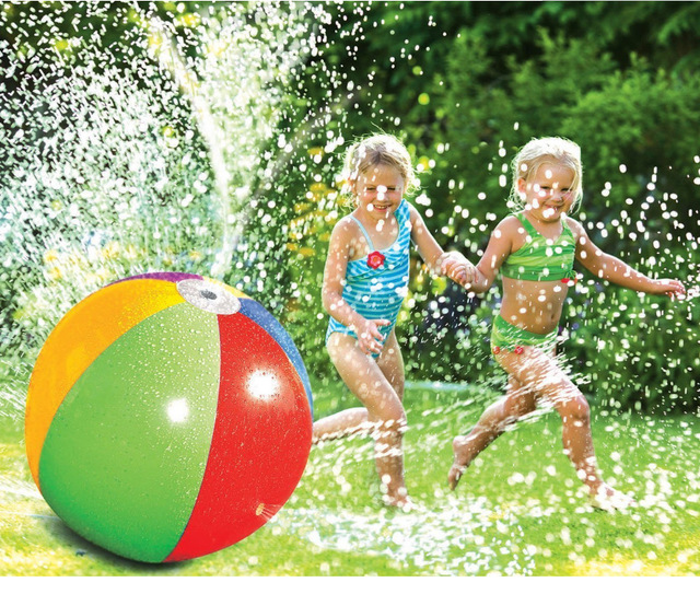 Two kids playing with water splashes