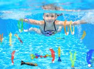 Image showing an underwater view of a swimming kid