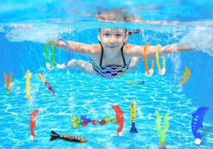 Image showing an underwater view of a swimming kid