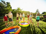 Group of kids playing with water games