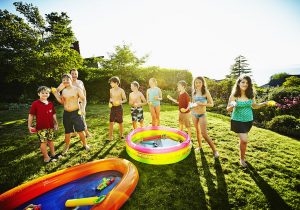 Group of kids playing with water games