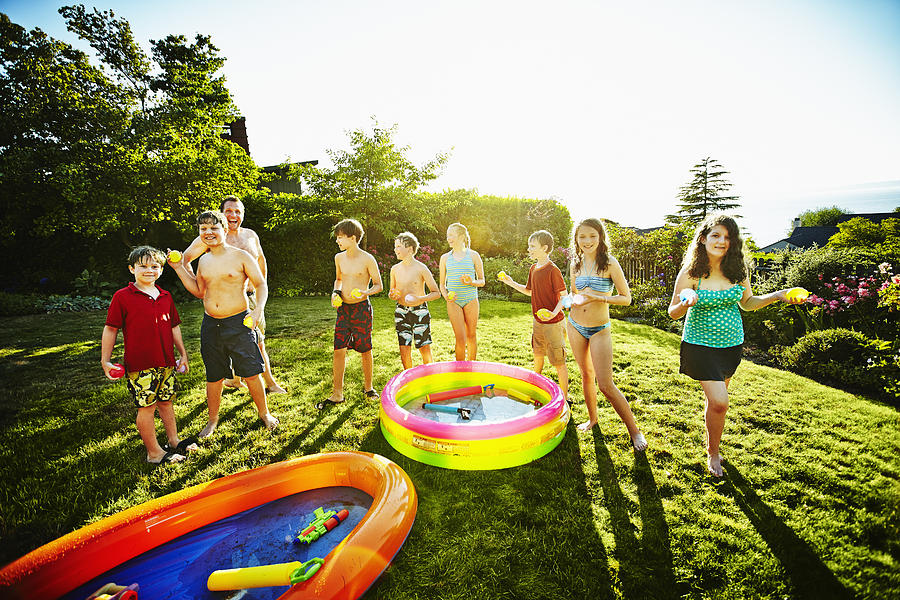 Group of kids playing with water games