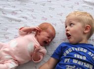 Image showing a boy shouting to his cute little baby brother