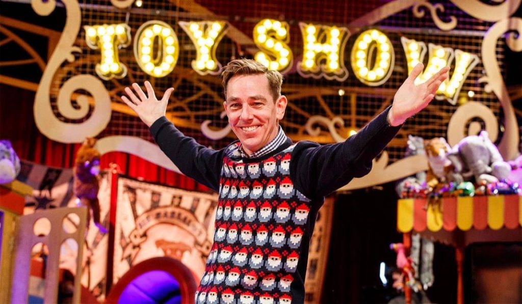 Image Showing A Smiling man warm welcoming the guest for the toy show